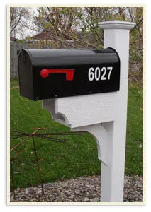 A Black Mailbox with a White Base