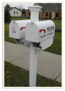 Two Desinger White Mailboxes on One Pole
